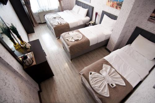 an overhead view of a bedroom with two beds at Golden Horn Park Hotel in Istanbul