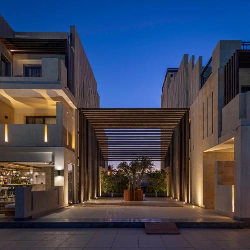 a hallway between two buildings in a city at Creek Hotel and Residences El Gouna in Hurghada