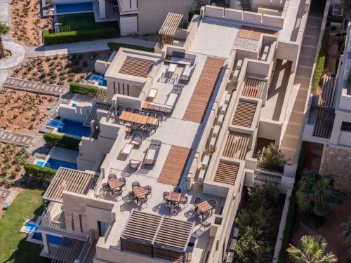 an overhead view of a building with tables and chairs at Creek Hotel and Residences El Gouna in Hurghada