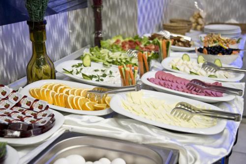 a table with several plates of food on it at Golden Horn Park Hotel in Istanbul