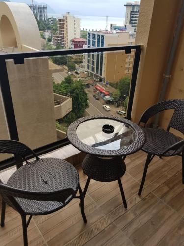a table and chairs on a balcony with a view at Euro Palace Gonio in Gonio