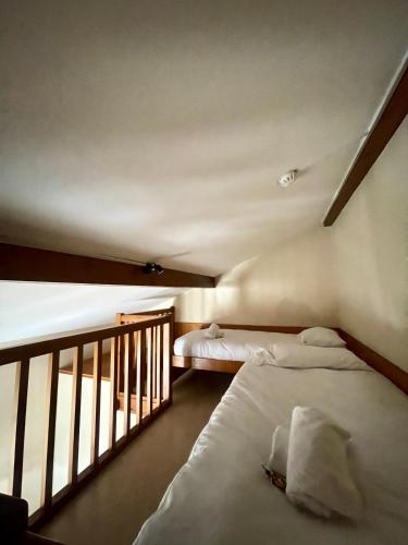 Ένα ή περισσότερα κρεβάτια σε δωμάτιο στο Hôtel Le MontBlanc