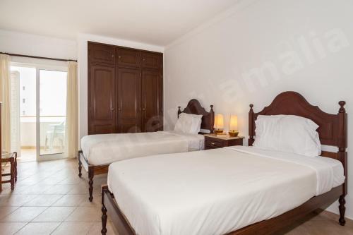 Ein Bett oder Betten in einem Zimmer der Unterkunft Apartment Amalia