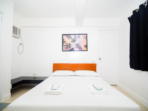 Postel nebo postele na pokoji v ubytování CJS Boracay Joint