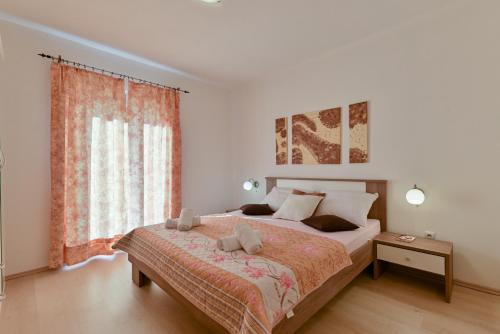 Postel nebo postele na pokoji v ubytování Apartman Mišura