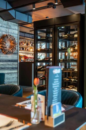a dining room with a table and chairs at Residenz Illyrica Tirol in Westendorf