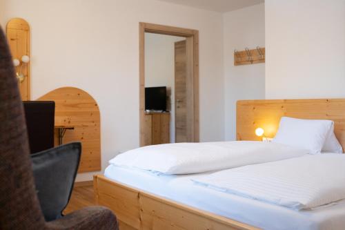 Ein Bett oder Betten in einem Zimmer der Unterkunft Pension Fischinger