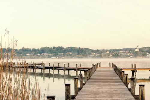a dock on a body of water at Bernhardhof Andechs in Andechs