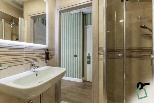 a bathroom with a sink and a shower at HOTIDAY Hotel Roma Porta Pia in Rome