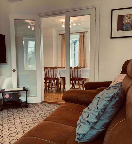 a living room with a couch and a dining room at Wonderful Town House where are current President Connolly has stayed while visiting town in Killarney