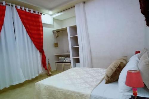 מיטה או מיטות בחדר ב-Atico panoramico