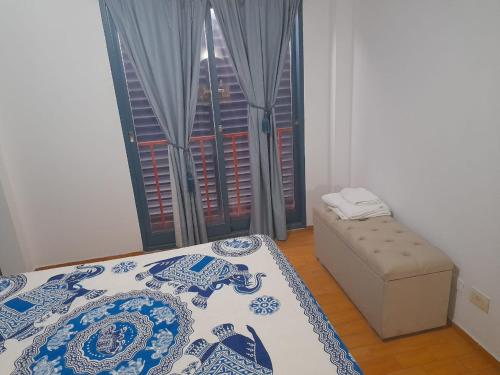 a bedroom with a bed and a window at alquiler temporario en Córdoba Capital, excelente ubicación in Cordoba