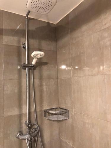 a shower with a shower head in a bathroom at Villa Allexia- APARTMENT SOL - Puerto Pollensa in Port de Pollensa