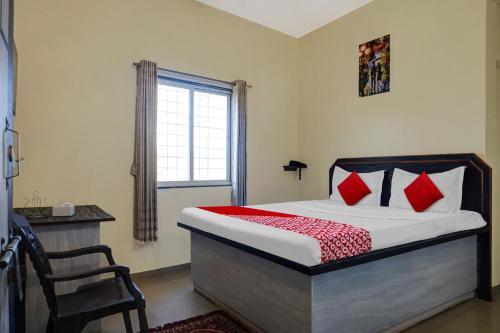 Ένα ή περισσότερα κρεβάτια σε δωμάτιο στο Hotel O Happy Homely Stay