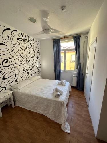 מיטה או מיטות בחדר ב-Rosales Residences