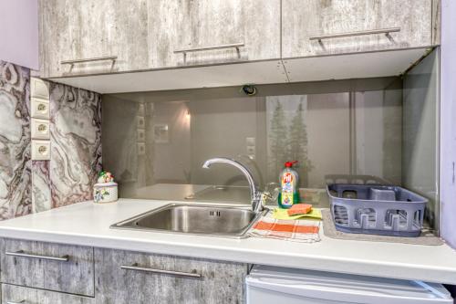 a kitchen with a sink and a counter top at Magical View Studios 1 Asproneri, Kamena Vourla in Kamena Vourla