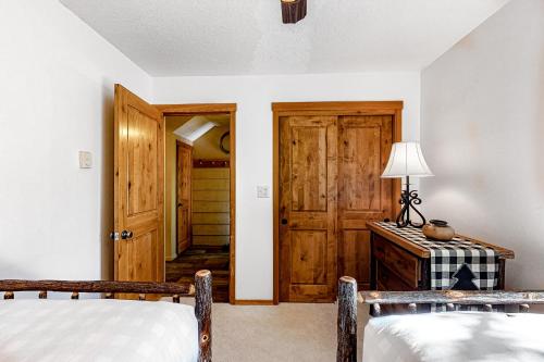 a bedroom with two beds and a door at 5123 Foxtail in Wilson