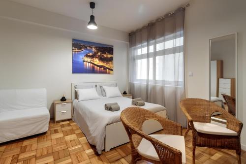 Postel nebo postele na pokoji v ubytování FindMe InPorto Santa Catarina