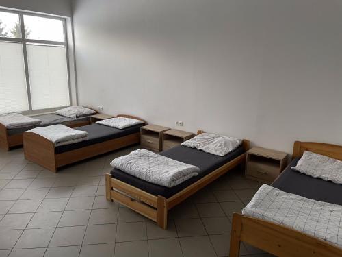 Postel nebo postele na pokoji v ubytování Noclegi Pracownicze LAZUR