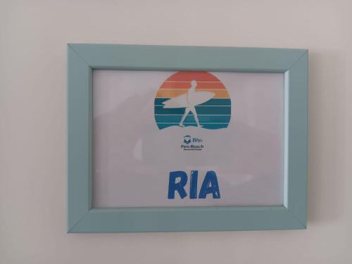 a framed picture of a woman on the beach at Blife Faro Beach Hostel & Rooms in Faro