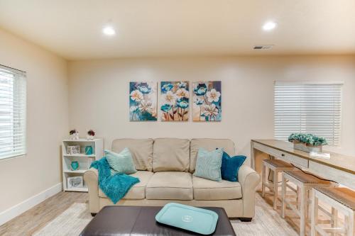 a living room with a couch and a table at Modern Lehi Apartment 2 Mi to Thanksgiving Point in Lehi