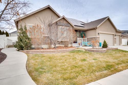 a house with a landscaping in front of a yard at Modern Lehi Apartment 2 Mi to Thanksgiving Point in Lehi
