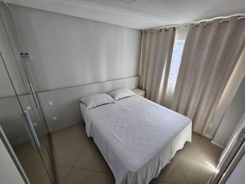 A bed or beds in a room at Apartamento alto padrão no 16º andar com 3 quartos TOP