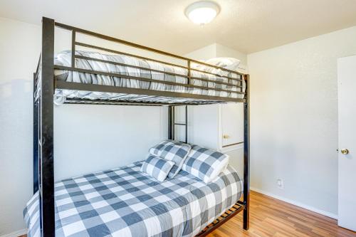a bedroom with two bunk beds in a house at Pet-Friendly Atoka Vacation Rental with Large Yard! in Atoka