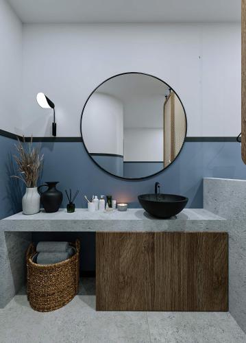 a bathroom with a sink and a mirror at Casa di Cornaro in Sitia