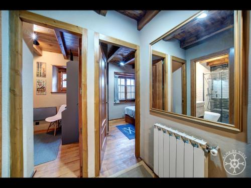 a hallway of a house with a room with a radiator at CASA SAUTARETH de Alma de Nieve in Tredós