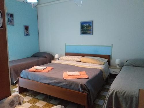 Кровать или кровати в номере LG Appartamento Turistico Acireale