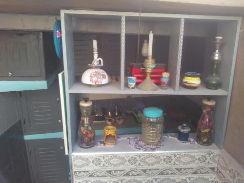a cupboard filled with lots of different types of items at Grotte de pêcheurs RITAJ, Aglou in Tiznit