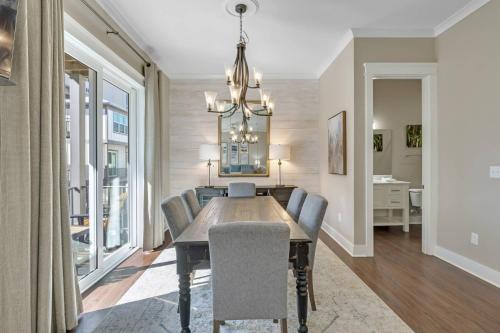 a dining room with a dining table and chairs at The Nautilus in Gulf Shores