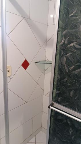a shower with a glass door in a bathroom at Pousada Sobre as Ondas - ILHA DO MEL - PR in Ilha do Mel
