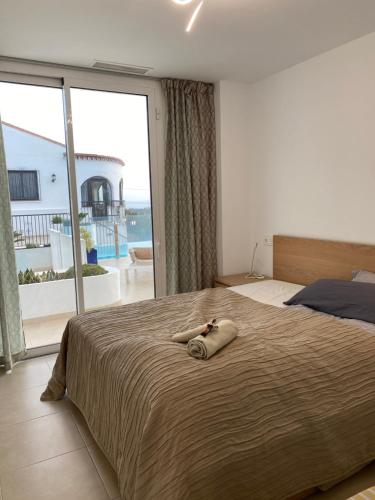 a woman laying on a bed in a bedroom at Villa Hesla in Estepona