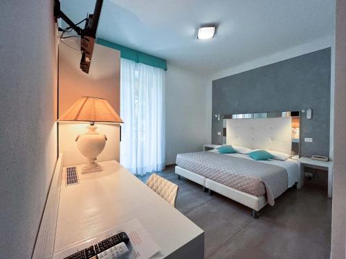 Кровать или кровати в номере Hotel Brigantino