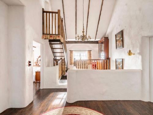 a large living room with a staircase and a living room at Rosehill House in Dungannon