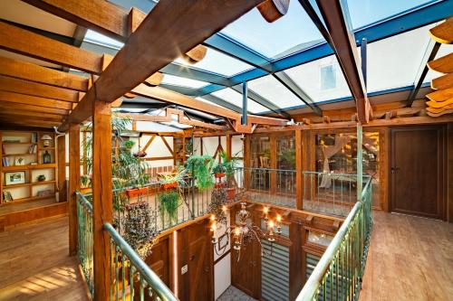 a conservatory with a balcony with a glass ceiling at Guest house Diabora-Veliko Tarnovo in Veliko Tŭrnovo