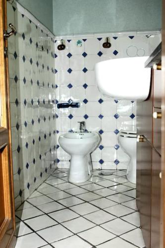 a bathroom with a toilet and a bidet in it at Casa Rosa Atrani in Atrani