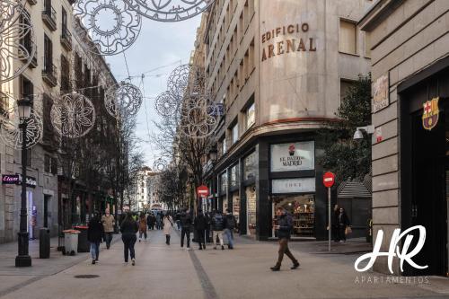 a busy city street with people walking down the street at HR-Madrid-Puerta del Sol in Madrid