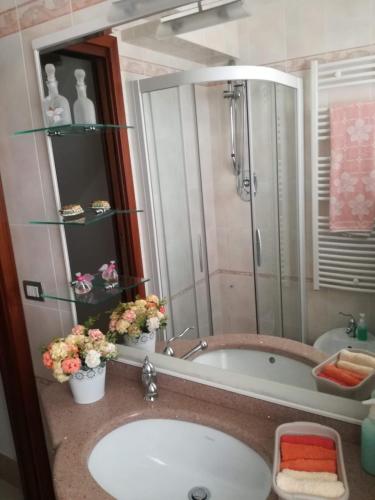 a bathroom with a sink and a bath tub at B&B Casa del Capitano in Chioggia