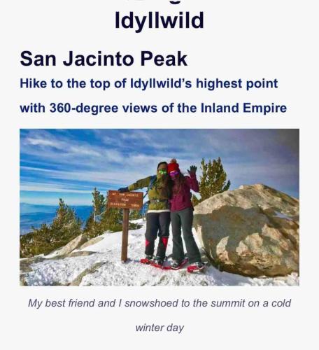 two people standing next to a sign on a mountain at Blissfully Wild -with Hot Tub and pets are welcome in Idyllwild