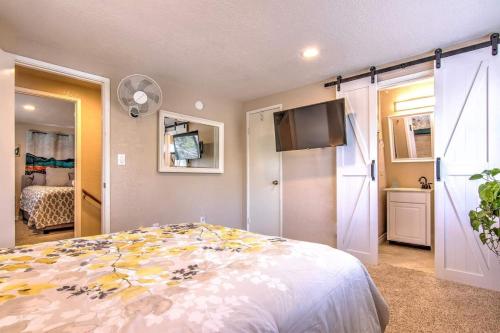 a bedroom with a bed and a flat screen tv at Blissfully Wild -with Hot Tub and pets are welcome in Idyllwild