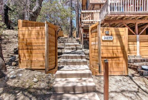 a set of stairs leading up to a house at Blissfully Wild -with Hot Tub and pets are welcome in Idyllwild