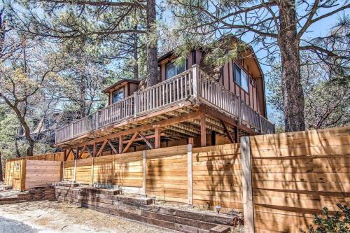 a house on top of a wooden fence at Blissfully Wild -with Hot Tub and pets are welcome in Idyllwild