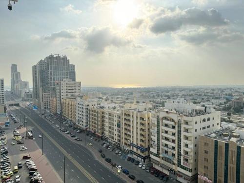 a view of a city with cars and buildings at Studio in Fujairah,CIT&SEA view in Fujairah