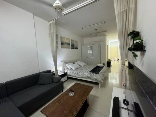 a living room with a couch and a bed at Studio in Fujairah,CIT&SEA view in Fujairah