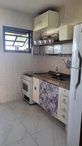 Η κουζίνα ή μικρή κουζίνα στο Casa Praia das Dunas Residence Club