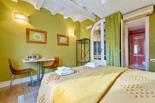 a bedroom with a bed and a table and a window at Salicornia Doble in Amposta