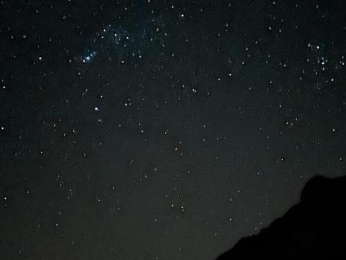 a starry night with the milky way in the sky at Jabal Shams bayt kawakib in Misfāh